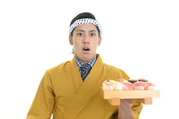 驚いた表情の寿司職人