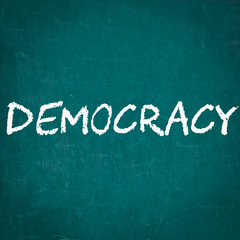 DEMOCRACY written on chalkboard