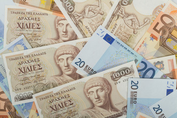 Fototapeta na wymiar Old Greek 1000 drachmas banknotes and euro bills.