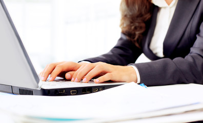 Business woman in the office, work at the computer