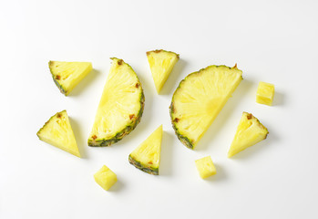 Fresh pineapple slices and wedges