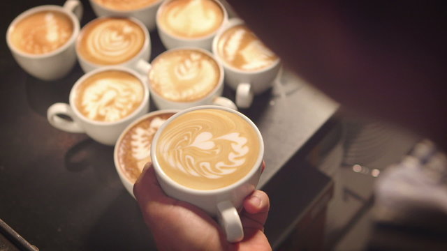 Closeup of Barista making latte art