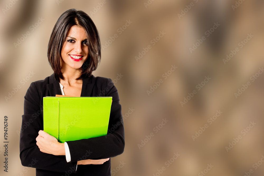 Wall mural smiling professional woman on brown background