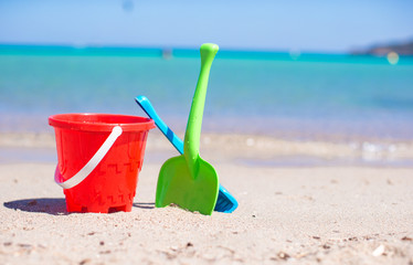 Summer kid's beach toys in the white sandy beach