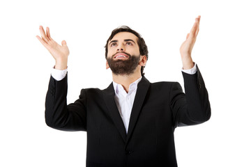 Businessman showing empty copyspace in hands.