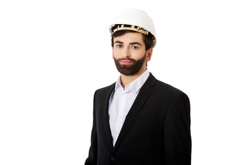 Handsome engineer in protective helmet.