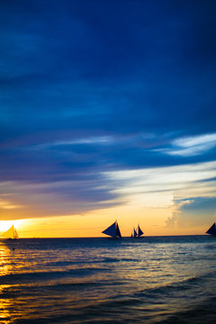 Sailing boats in beautiful sunset