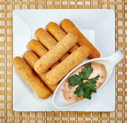 Top view of fried chicken nuggets with spicy sauce