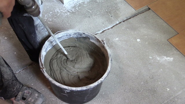Mixing tile adhesive or cement with power drill tool