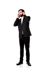 Businessman listening to music.