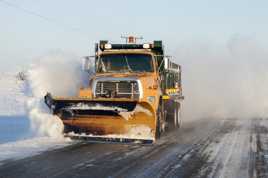 Snow plower on rural road
