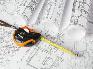 Tape measure over a construction plan drawing