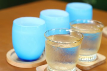 Blue glass of water on table