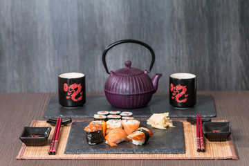 Sushi served on a black ceramic