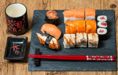 Sushi served on a black ceramic