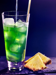 Green pineapple cocktail  on dark background 4.