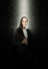 Glowing Businesswoman Showing Thumbs up on Black