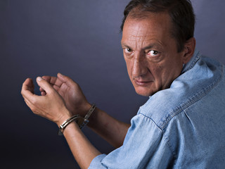 Man, mature, with handcuffs