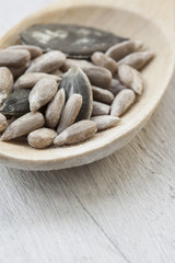 pumpkin and sunflower seed in wooden spoon