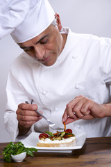 Chef elaborating a plate of food