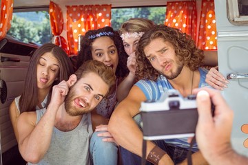 Hipster friends in a camper van