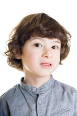 Portrait of a boy with a painful look. White background.