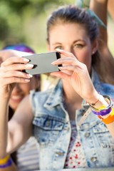 Excited music fan taking photo