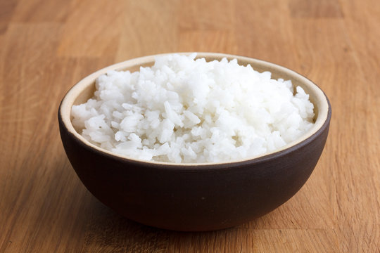 Rustic Bowl Of White Rice On Modern Wood Surface.