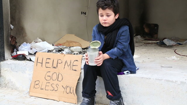 Homeless child begging in street