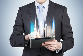 businessman holding touch pad