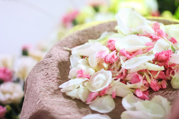 a packet of coloful petals in hasket
