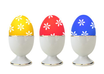 Colorful Easter Eggs in stand isolated on white