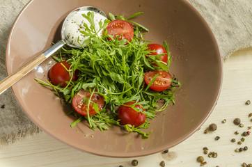 Watercress salad with cherry tomatoes and sour cream