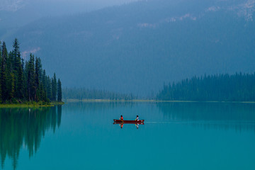 canoeing tranquil emerald lake