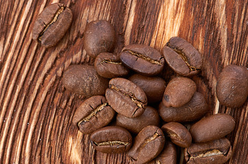 Coffee beans on wood background