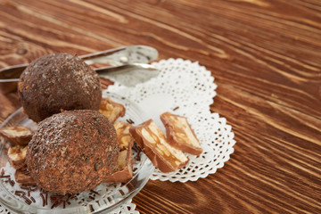 Cupcake with chocolate on wooden background
