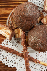 Cupcake with chocolate on wooden background