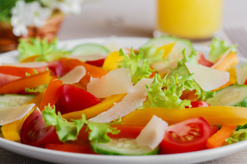 vegetable salad with tomato cucumber pepper and parmesan cheese