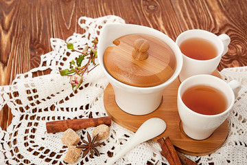 tea with sugar cubes on wooden