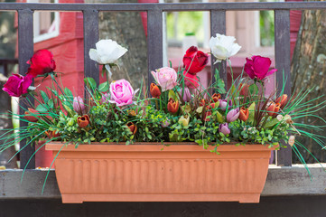 Artificial flowers in the basket in vintage theme