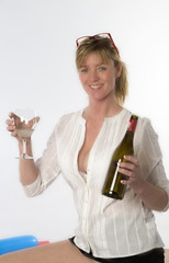 Female party goer holding glass of wine