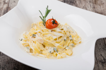 pasta with dorblue cheese on a white plate
