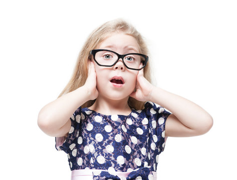 Beautiful little girl in glasses surprised isolated