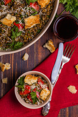 Stewed lentils with bacon, peppers and croutons