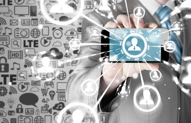Business Hand holding a phone show the social network
