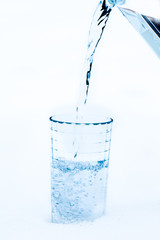 Pouring water in the glass