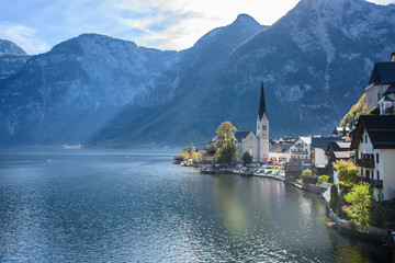 View of famous old town Hallstatt village in Alps at sunny day, Salzkammergut, Austria