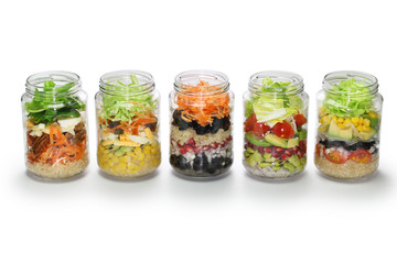 salad in glass jar, no lid, white background