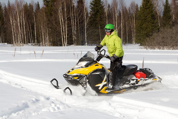 Athletes on a snowmobile.