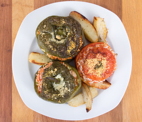 Stuffed pepper and tomato with rice and parmesan cheese